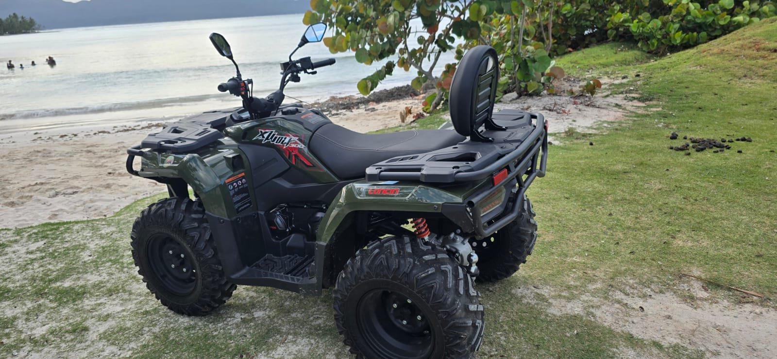 Rear three-quarter view of a J&R ATV beside the beach